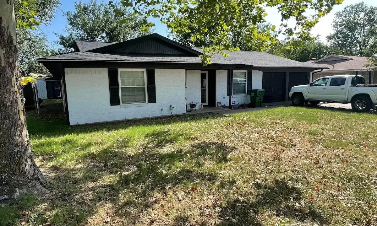 Professional roofing crew working on a residential roof in St. Simons