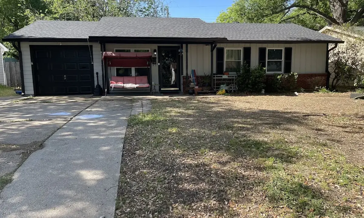 Wind Damage Roof Repair crew at work on a residential roof in St. Simons